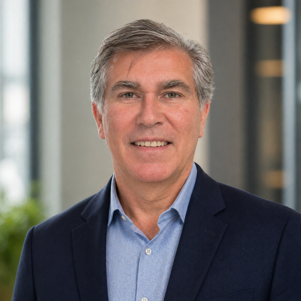 Juan Carlos Monzón wearing a navy blazer and blue shirt